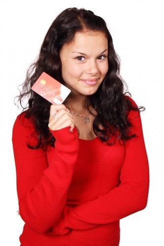 credit card guide - girl holding a credit card