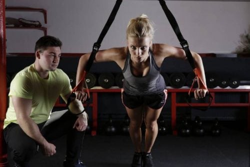 coach watching work out woman