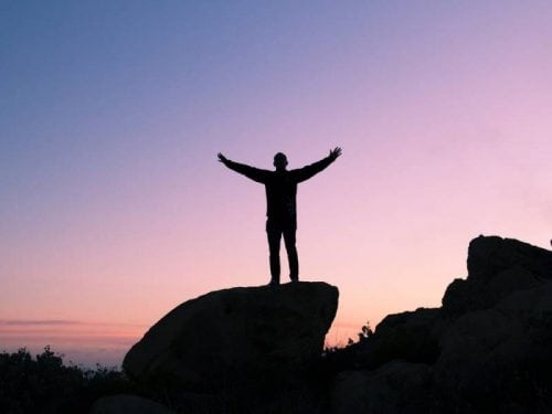 sunset man on mountain happy