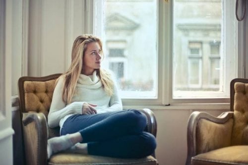 woman sitting by window