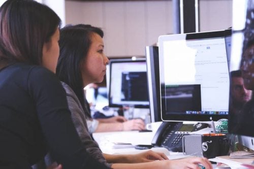 girls looking at computer