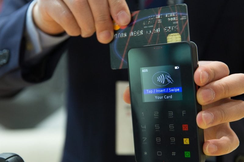 A man processing a credit card