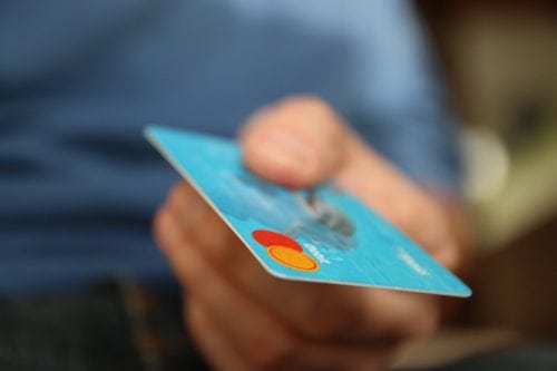 hand with credit card