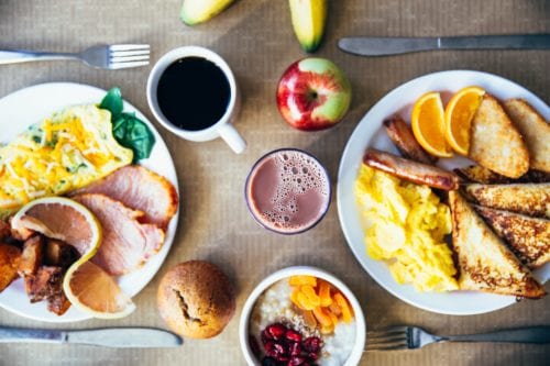 Overhead picture of a table covered in breakfast foods