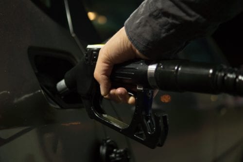 Image of a hand holding a gas pump