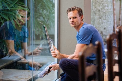 A man cleans the window