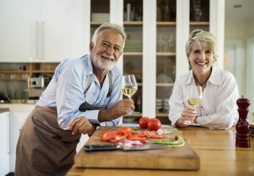 Couple cooking and eating together