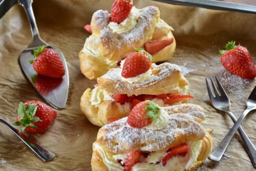 Strawberry eclairs with forks