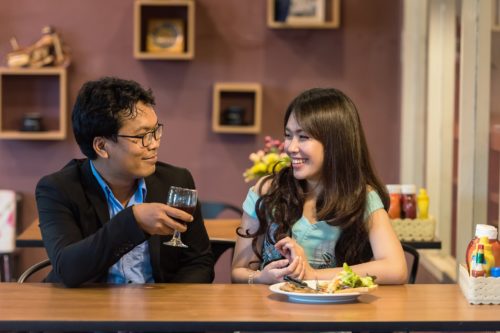 Couple eating dinner together