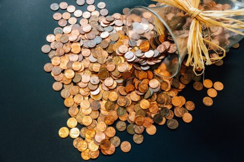 Pennies spilling from a jar