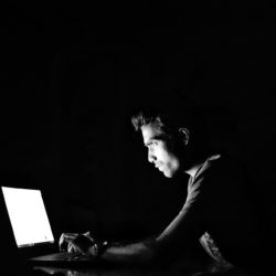 A fraudster hacking