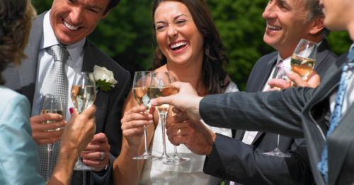 Friends toasting the bride and groom 