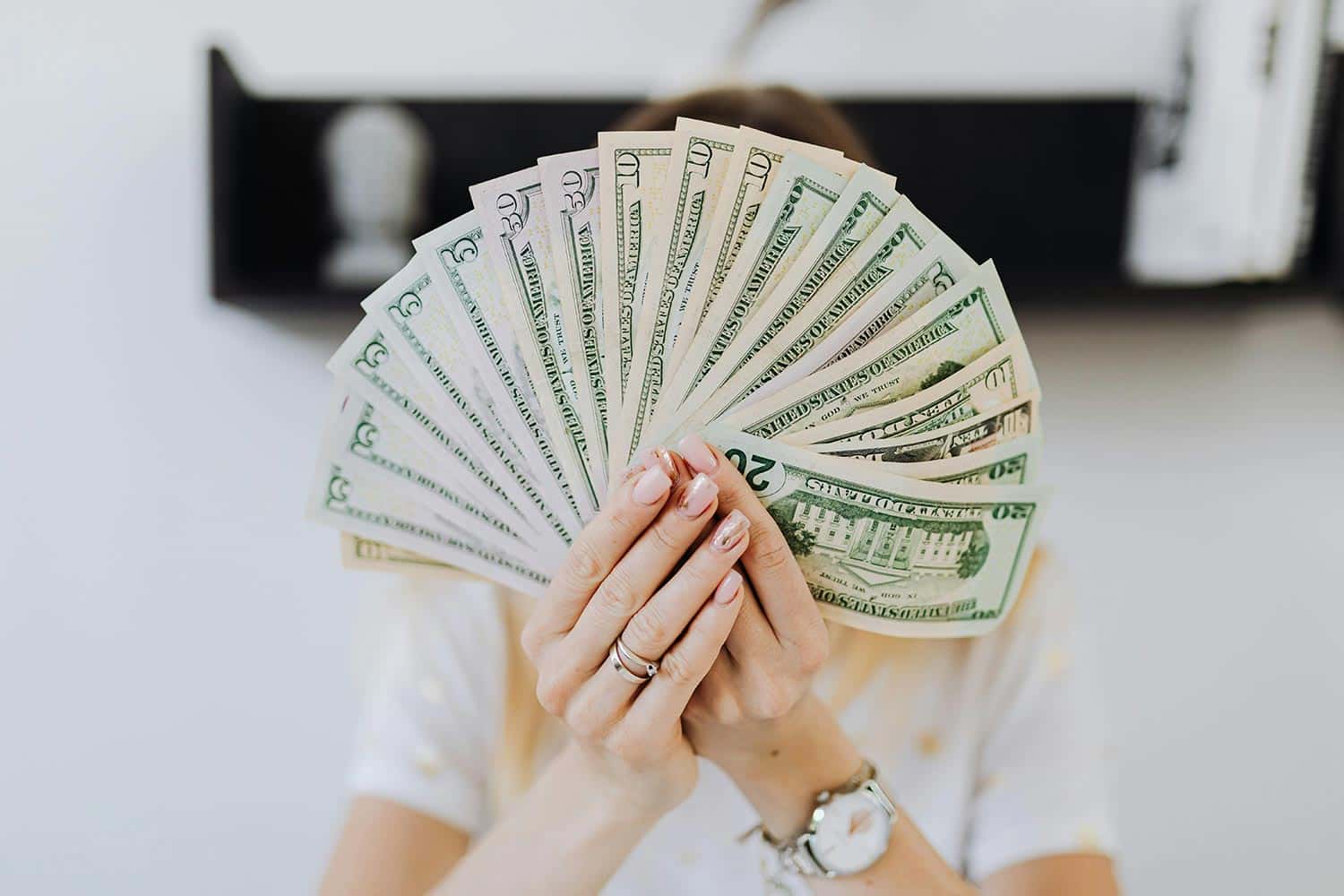 photo of a person holding cash